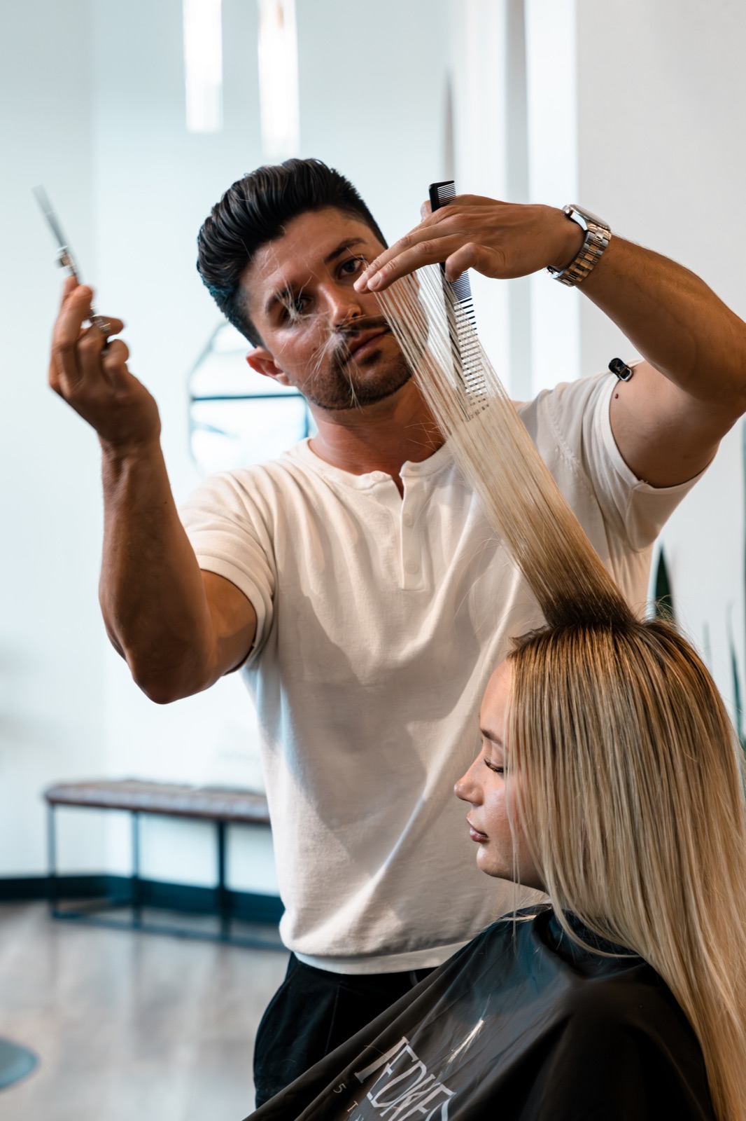 Gabriel cutting hair in the salon